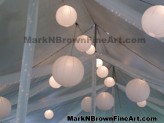 Lanterns adorn the tents of this lovely wedding reception