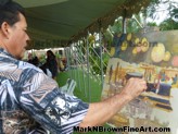 Mark N. Brown in action as he paints live on site during a wedding reception