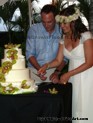 Happy couple cutting their cake
