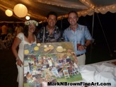 Plein Air artist Mark N. Brown presents his finished artwork to the happy couple