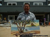 Hawaii artist Mark N Brown stands in front of the home donated to Staff Sergeant Tony Woods on the show Hero's Welcome