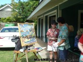 Lanikai residents chat with Hawaii Plein Air artist Mark Brown as he creates his art