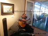 Musician Playing Background Music For Saturday Morning<br>Musician playing background music for Saturday morning patrons visit to Village Gallery and artists.
