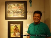 Artist Mark N.  Brown<br>Oahu Plein Air artist Mark N. Brown standing near his paintings during Saturday's breakfast with the artists.