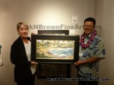 Kapalua Beach<br>Mark N. Brown holding painting with new owner of Kapalua Beach purchased at Village gallery on Friday's reception on 2/20.