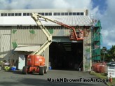 Hawaii Artist Mark N Brown and team work on the Nishimoto Trading Co. Mural