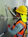 Hawaii artist Mark N Brown is hard at work on the new South Shore Market mural in Kakaako